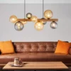 LED Pendelleuchte aus Holz 9-flammig Glaskugeln Rauchglas & Bernstein, B: 78cm