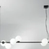 Pendelleuchte ENOIRE 6-flammig Schwarz mit Glaskugeln in Opalweiß, Breite 120cm