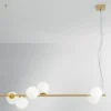 Pendelleuchte ENOIRE 6-flammig Gold mit Glaskugeln in Opalweiß, Breite 120cm